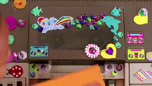 Gif from Kimbra's video for "90s Music": a child puts a video into a stickered machine and hits play.