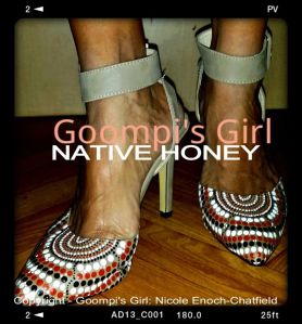 feet shod in a pair of high heels covered with a dot pattern