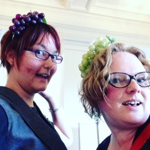 liz and steph wearing grape fascinators