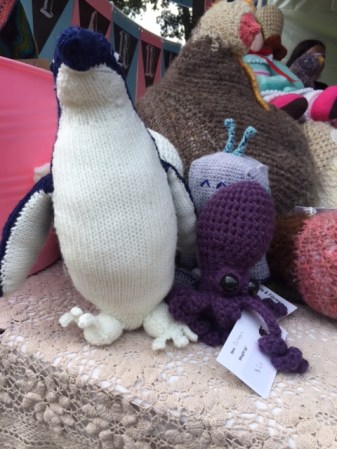 A knitted penguin and octopus hanging out.