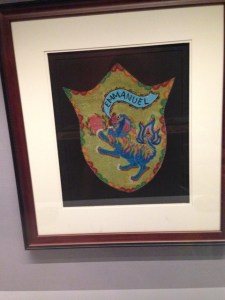 embroidered and beaded dragon crest with words 'emmanuel'